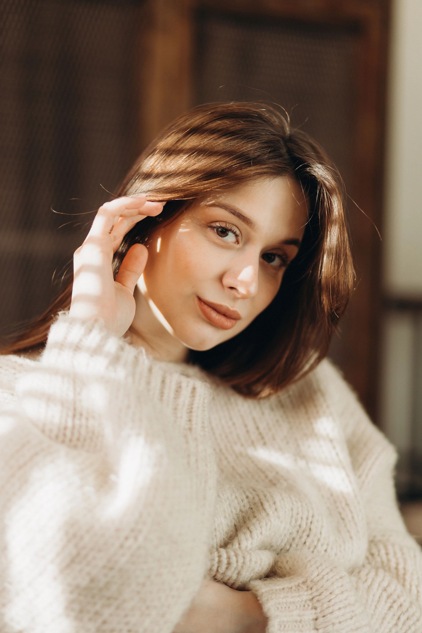 Warm portrait of a woman in soft window light